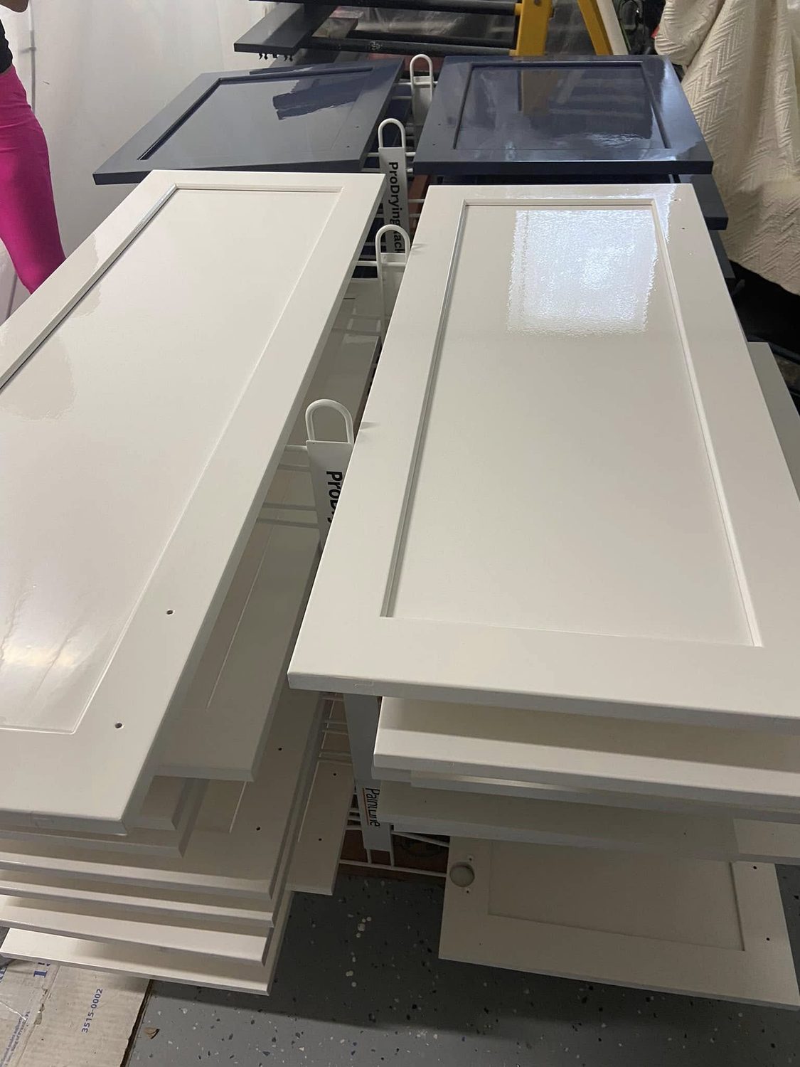 Doors off and racked to dry by Carolina Superior Painting LLC